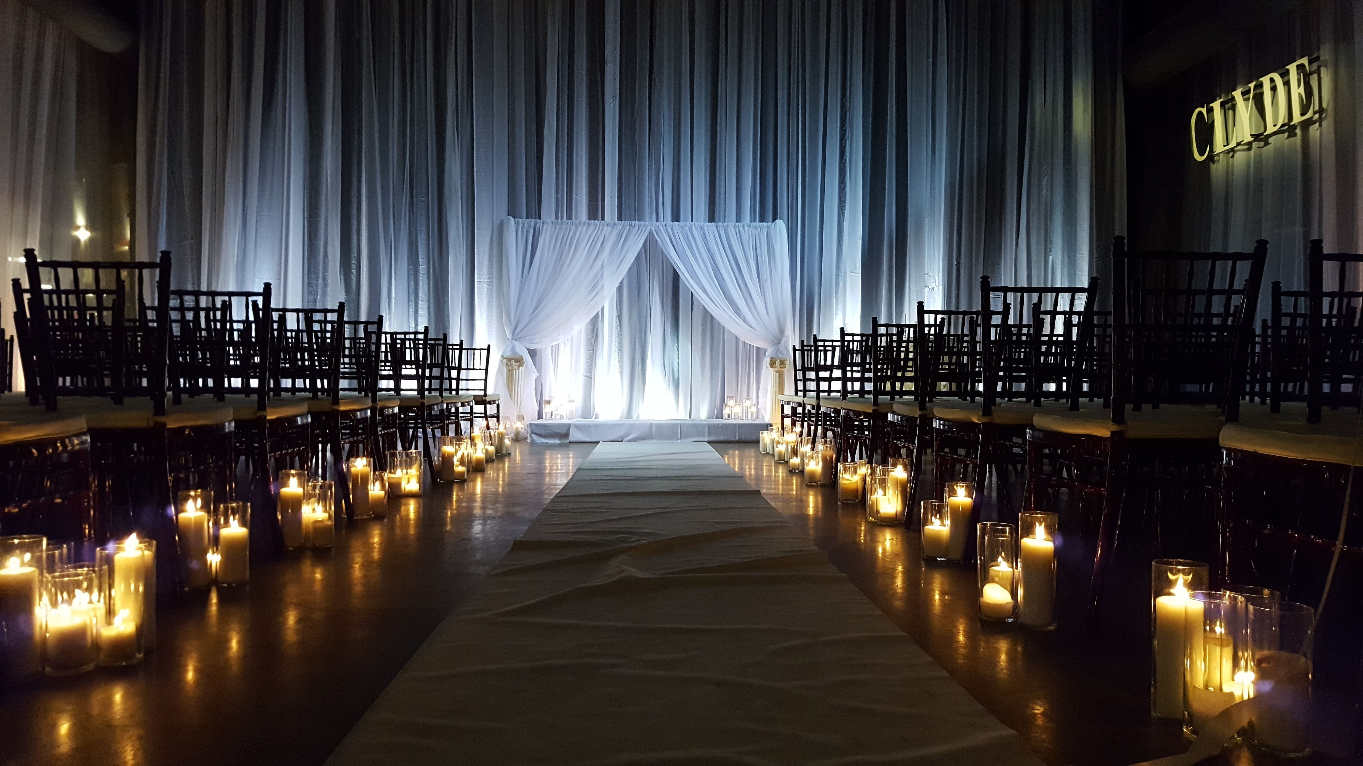 A Wedding at the Clyde Iron Works with a lighting backdrop by Duluth Event Lighting.