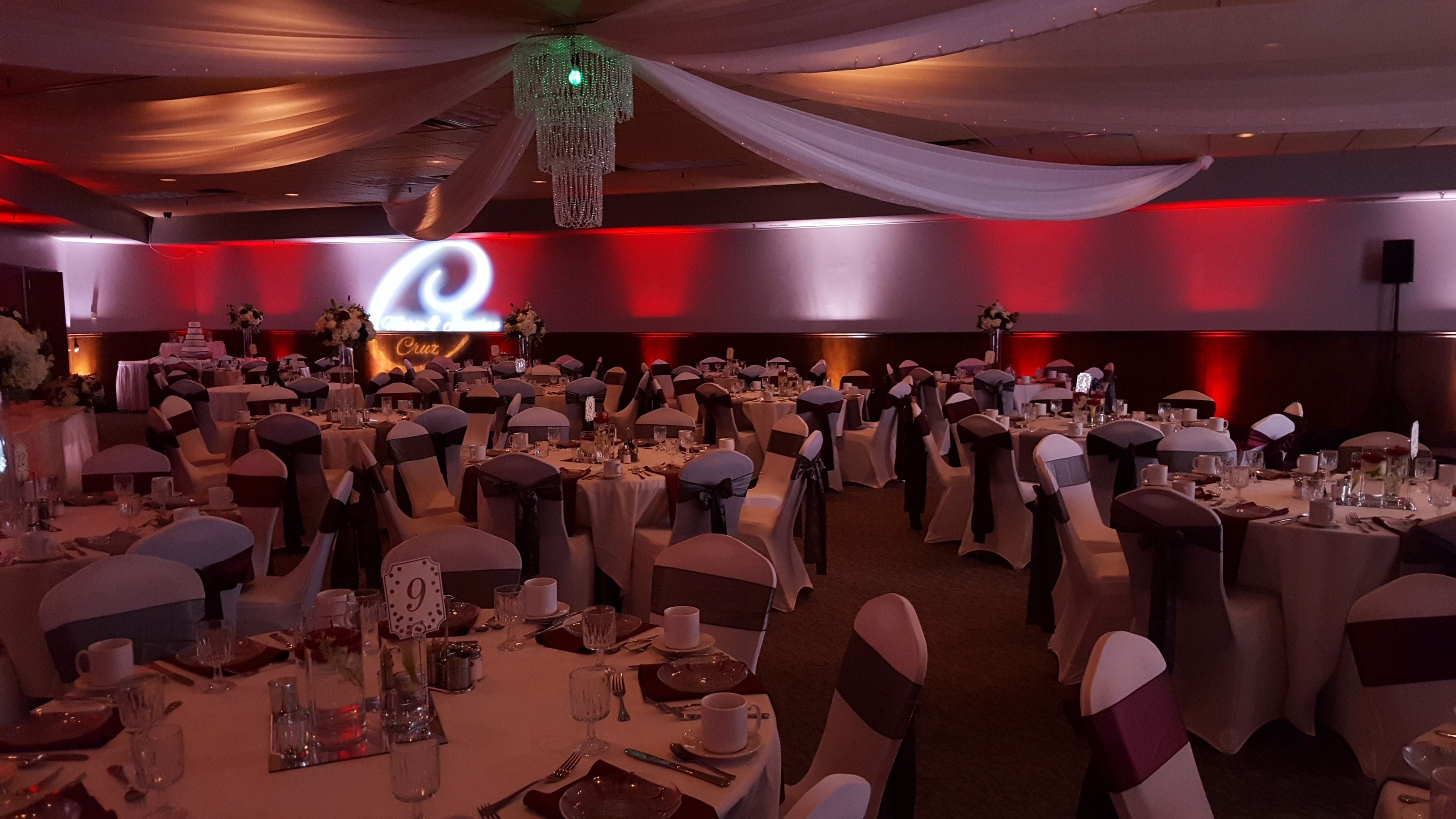 Wedding at Blackwoods Proctor. Up lighting in red and white with a monogram.