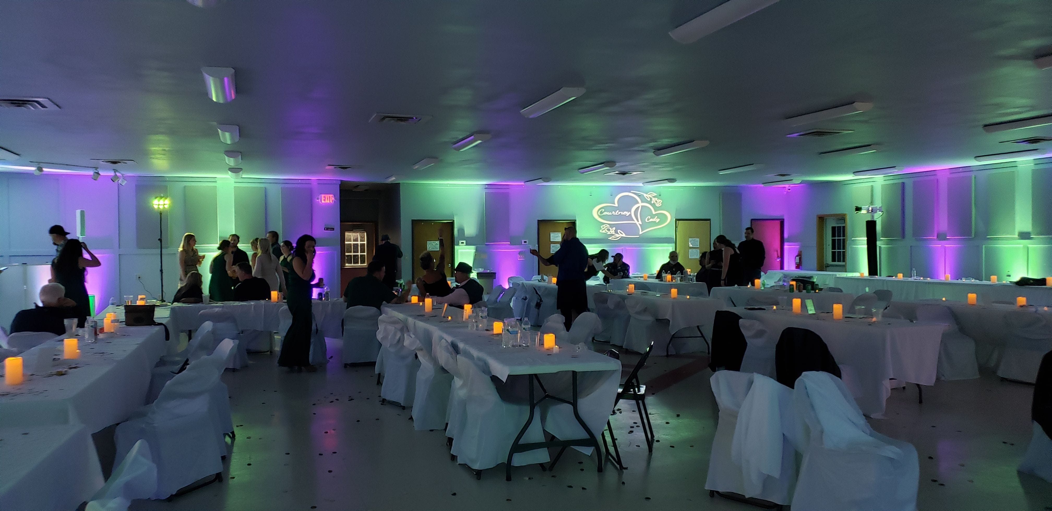 Wedding lighting by Duluth Event Lighting. Up lighting in purple and mint green at the Billings Park Community Center.