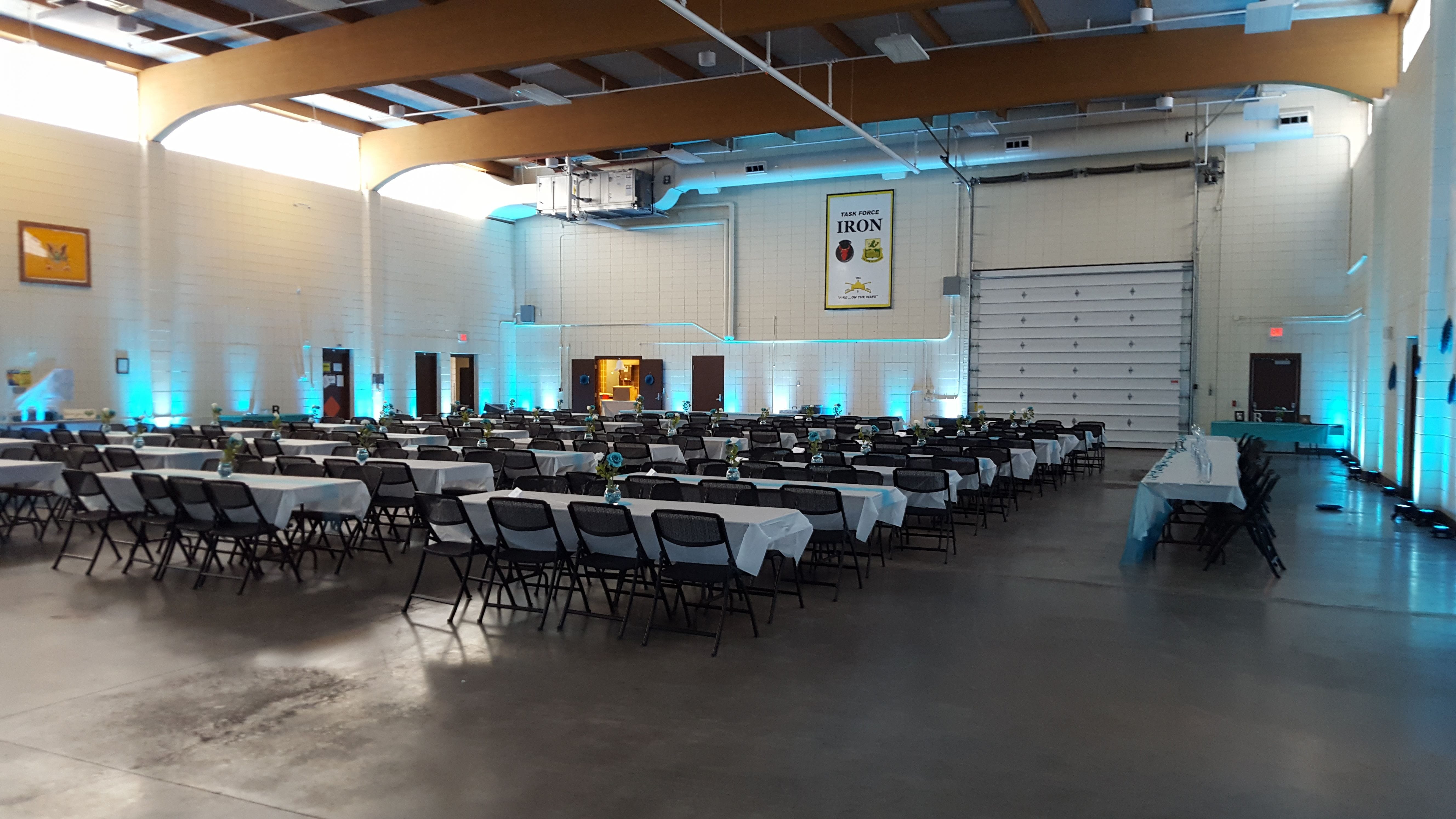 Duluth Armory wedding lighting by Duluth Event Lighting. Up lighting in teal.