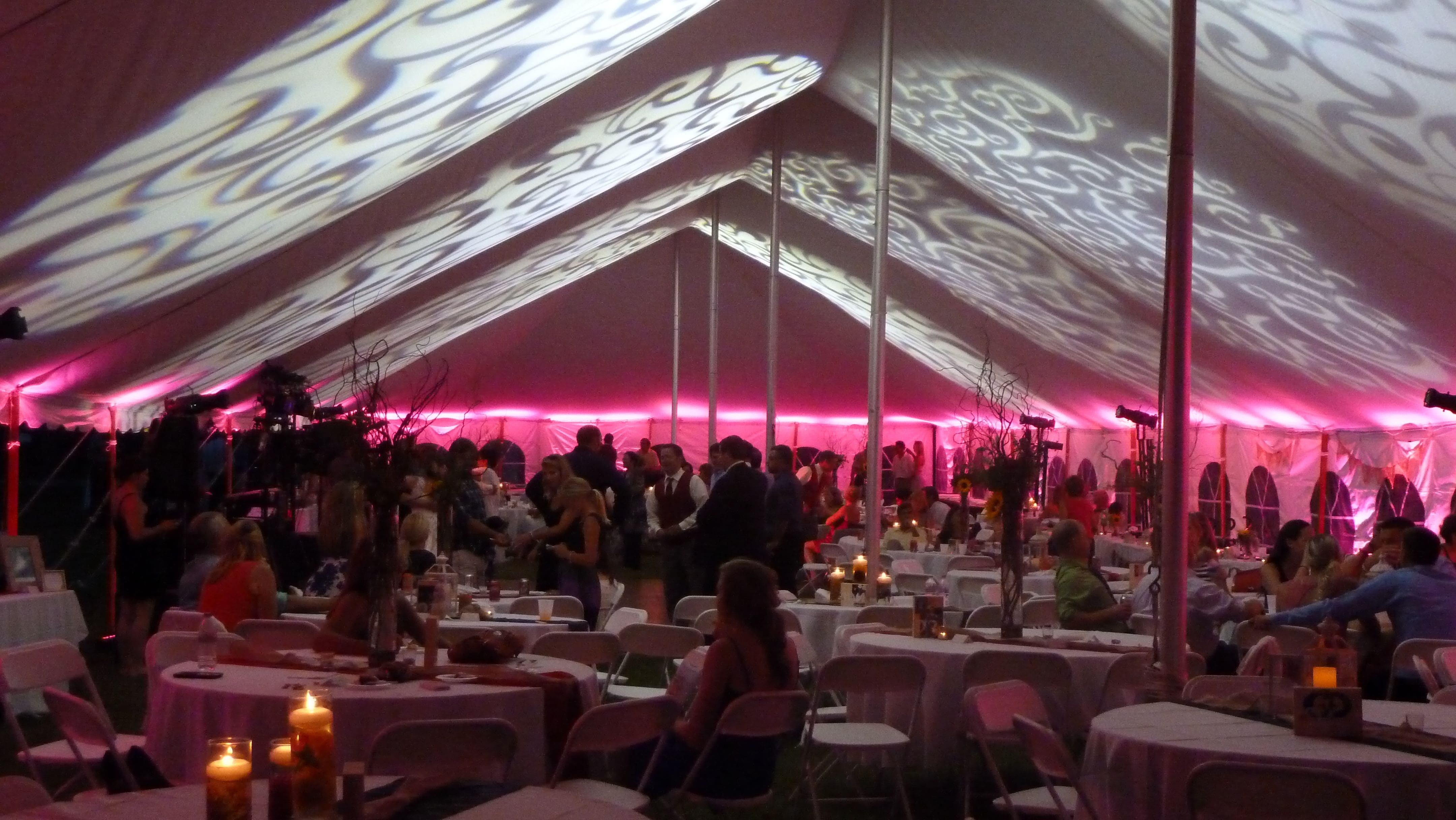 Fancy gobo patterns on the tent ceiling for a wedding.