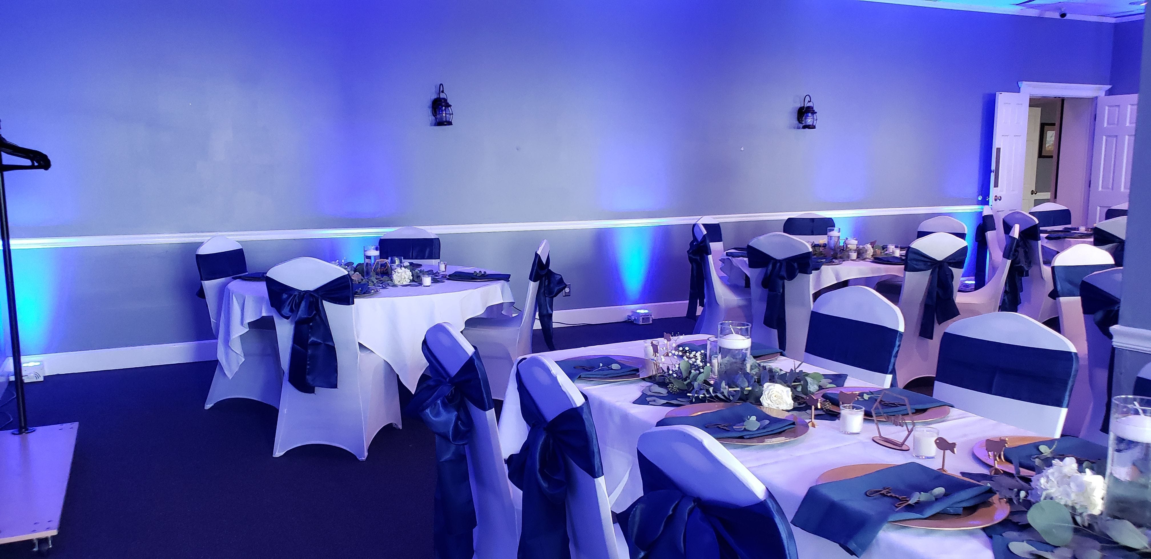 Wedding lighting at the Boat Club in Fitger's with blue up lighting by Duluth Event Lighting.