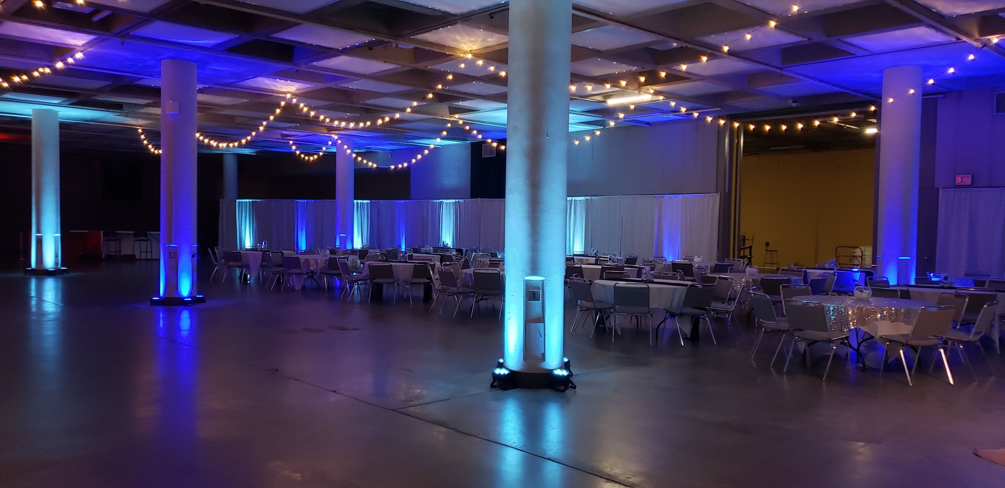 A flannel and frost themed event with red and blue up lighting, bistro, snowflake gobos and tree gobos. lighting by Duluth Event Lighting.