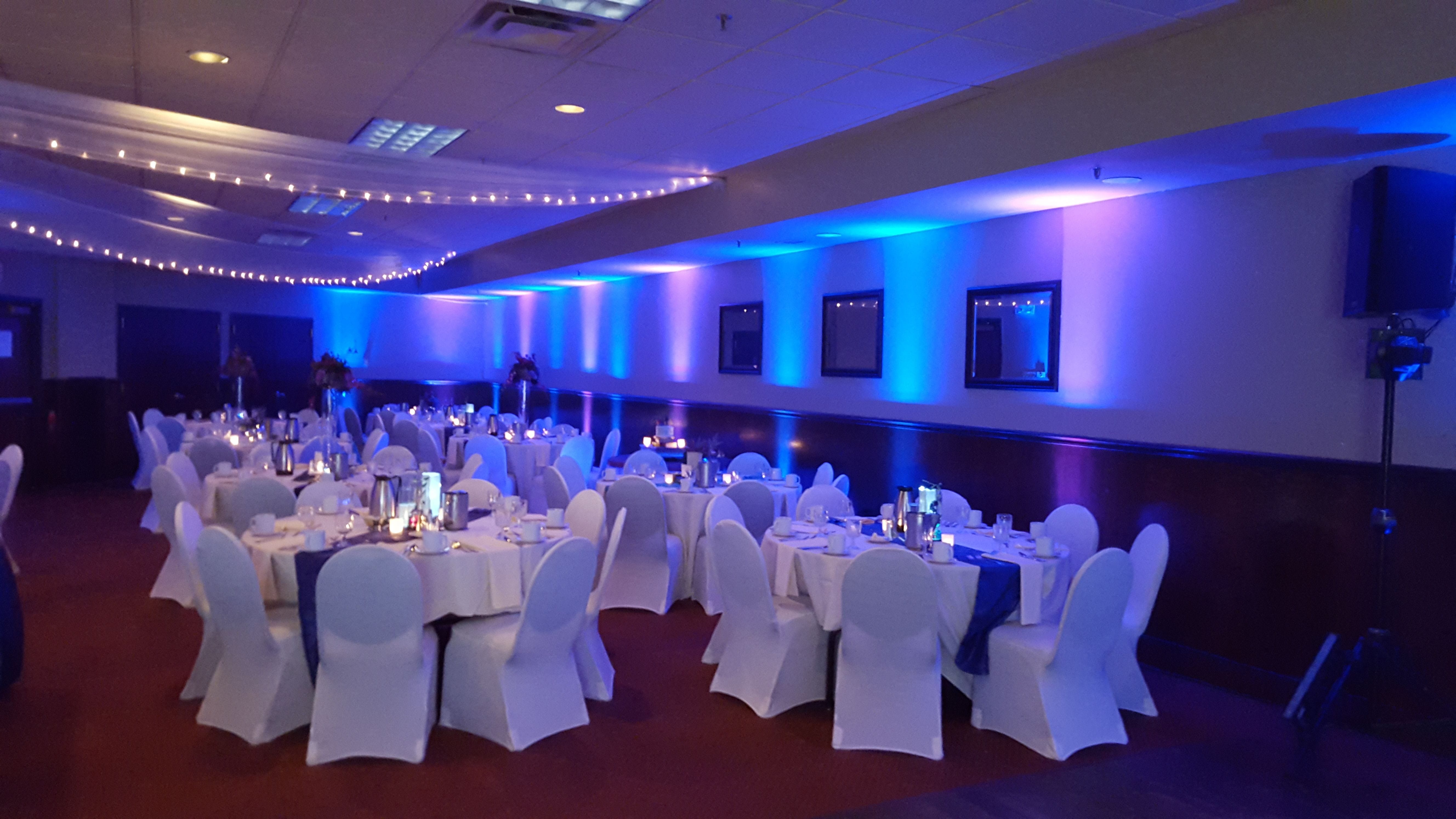 Up lighting in blue and plum purple at Blackwoods Event Center, Proctor.