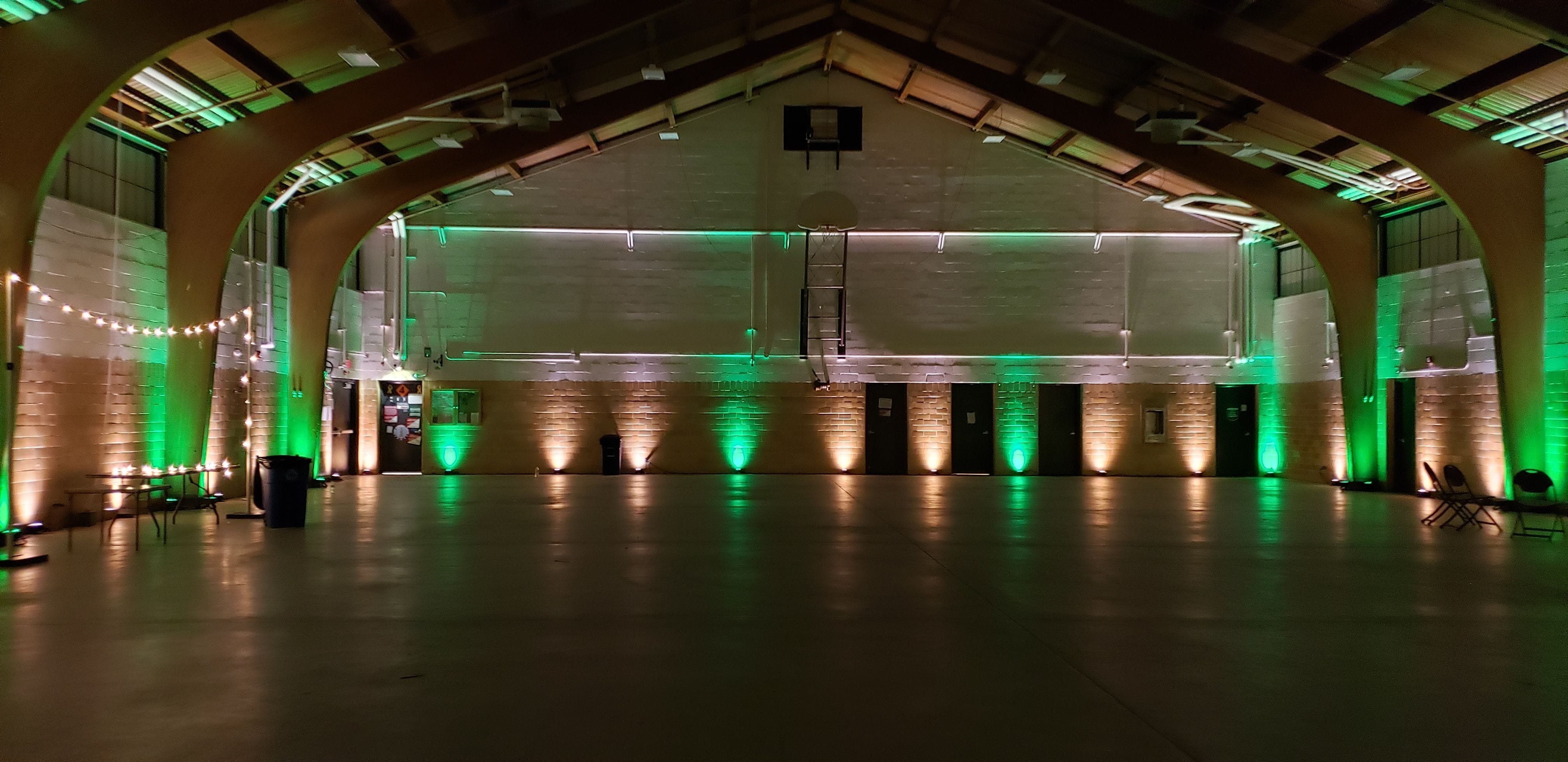 Wedding lighting at the Cloquet Armory by Duluth Event Lighting. Up lighting in green and soft white.