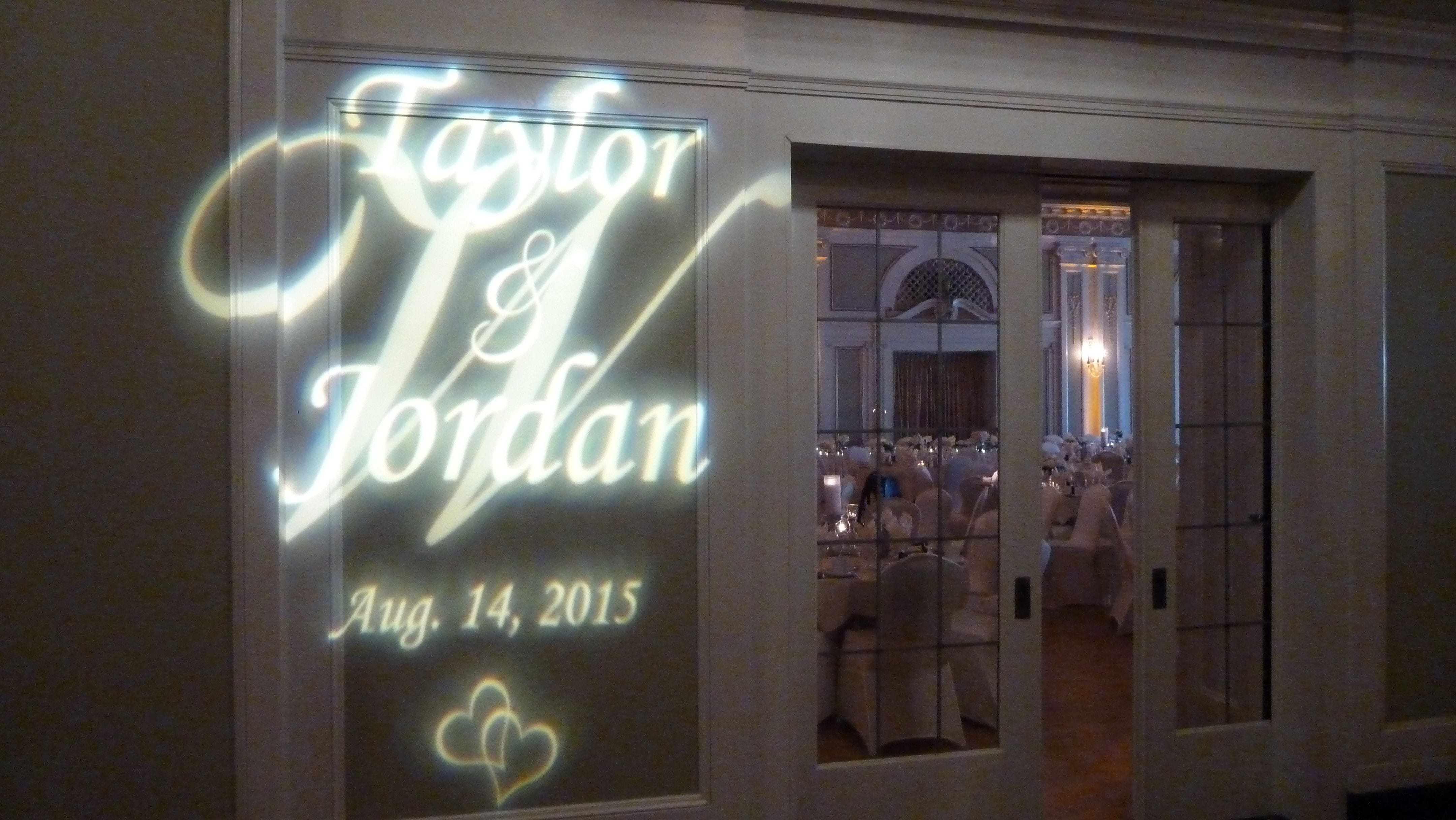 Wedding lighting at Greysolon Ballroom with a monogram on the wall.