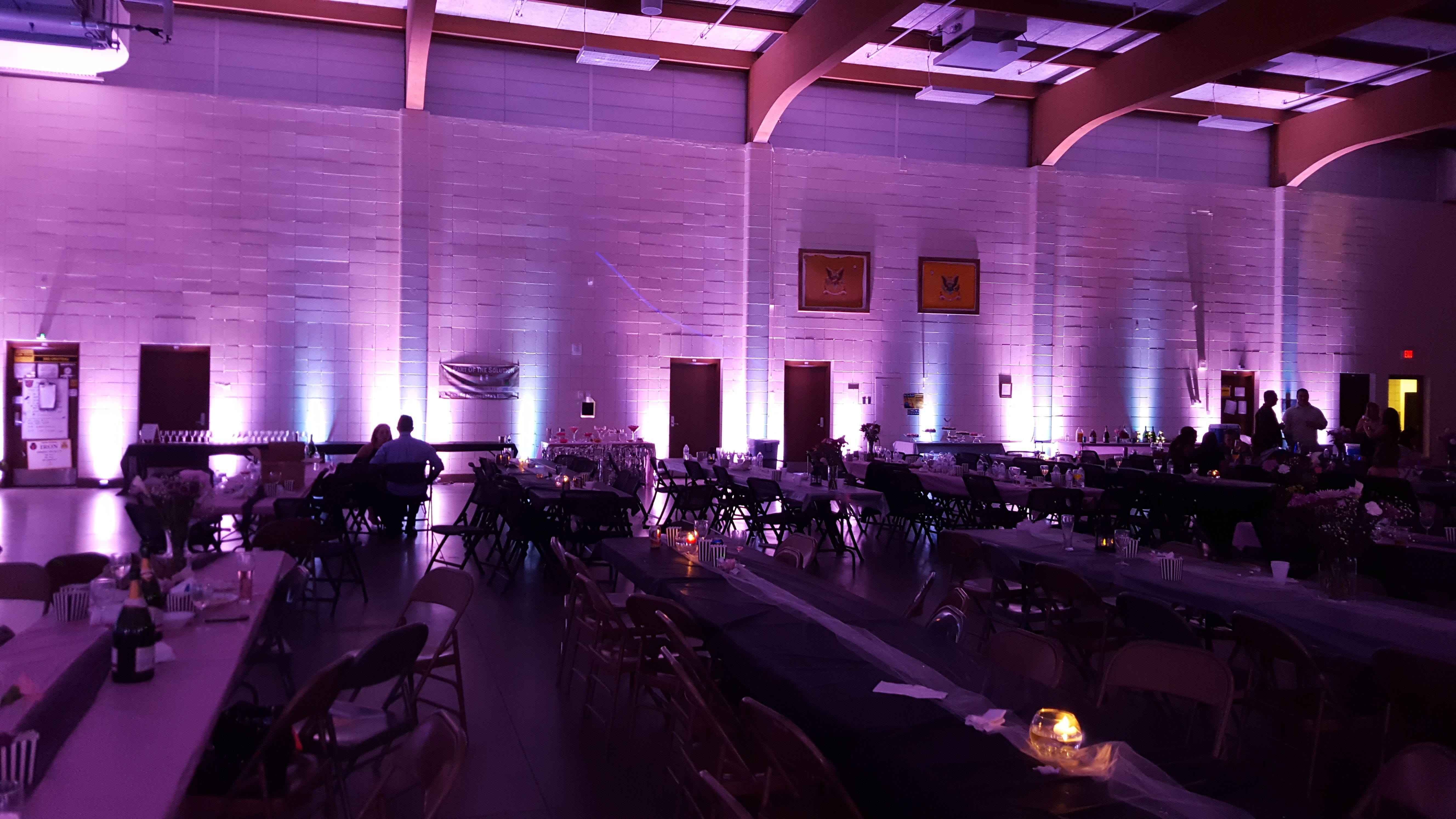Wedding lighting at the Duluth Armory. Up lighting in two tone lavender by Duluth Event Lighting