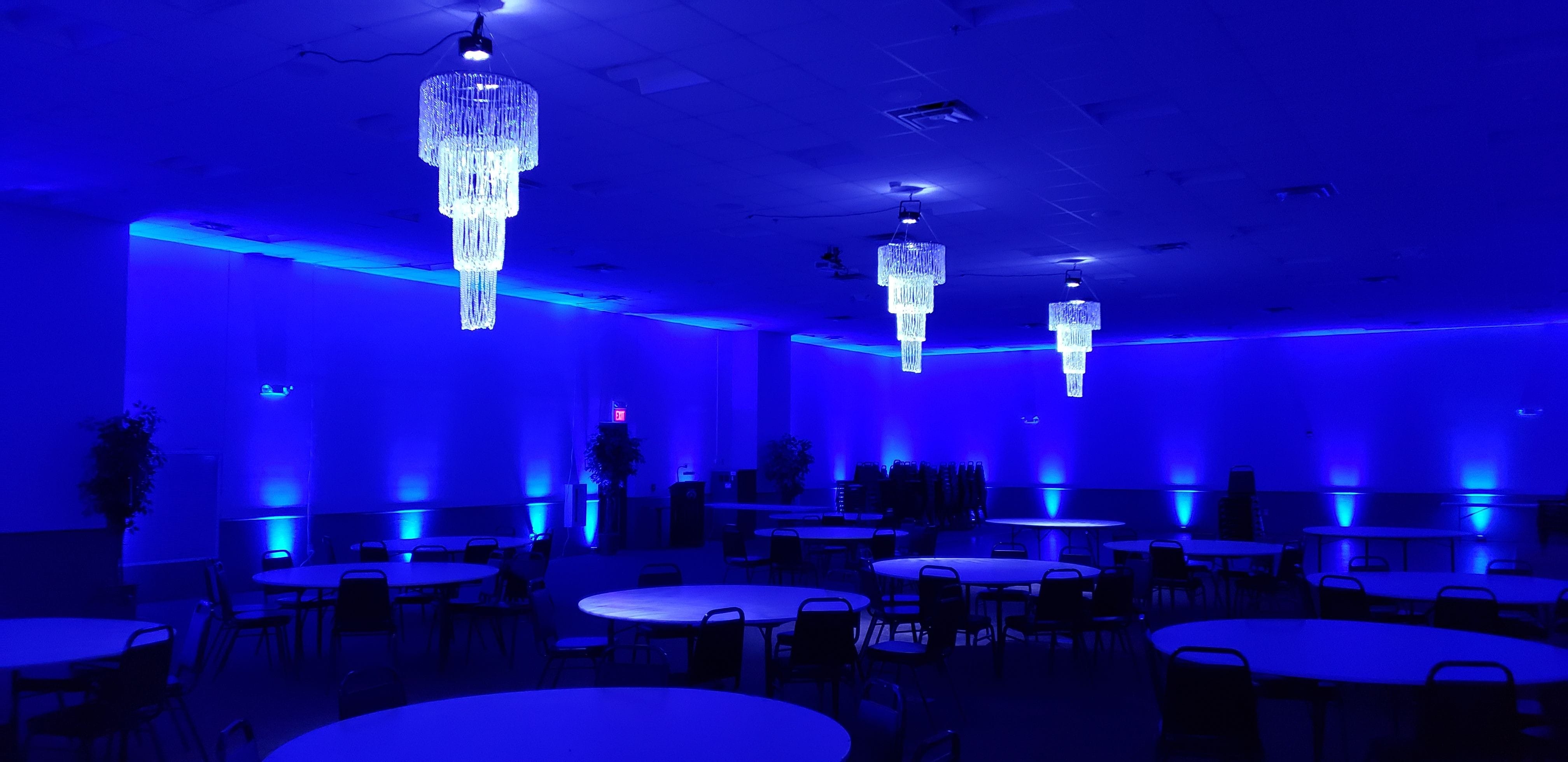 3 chandeliers with blue up lighting