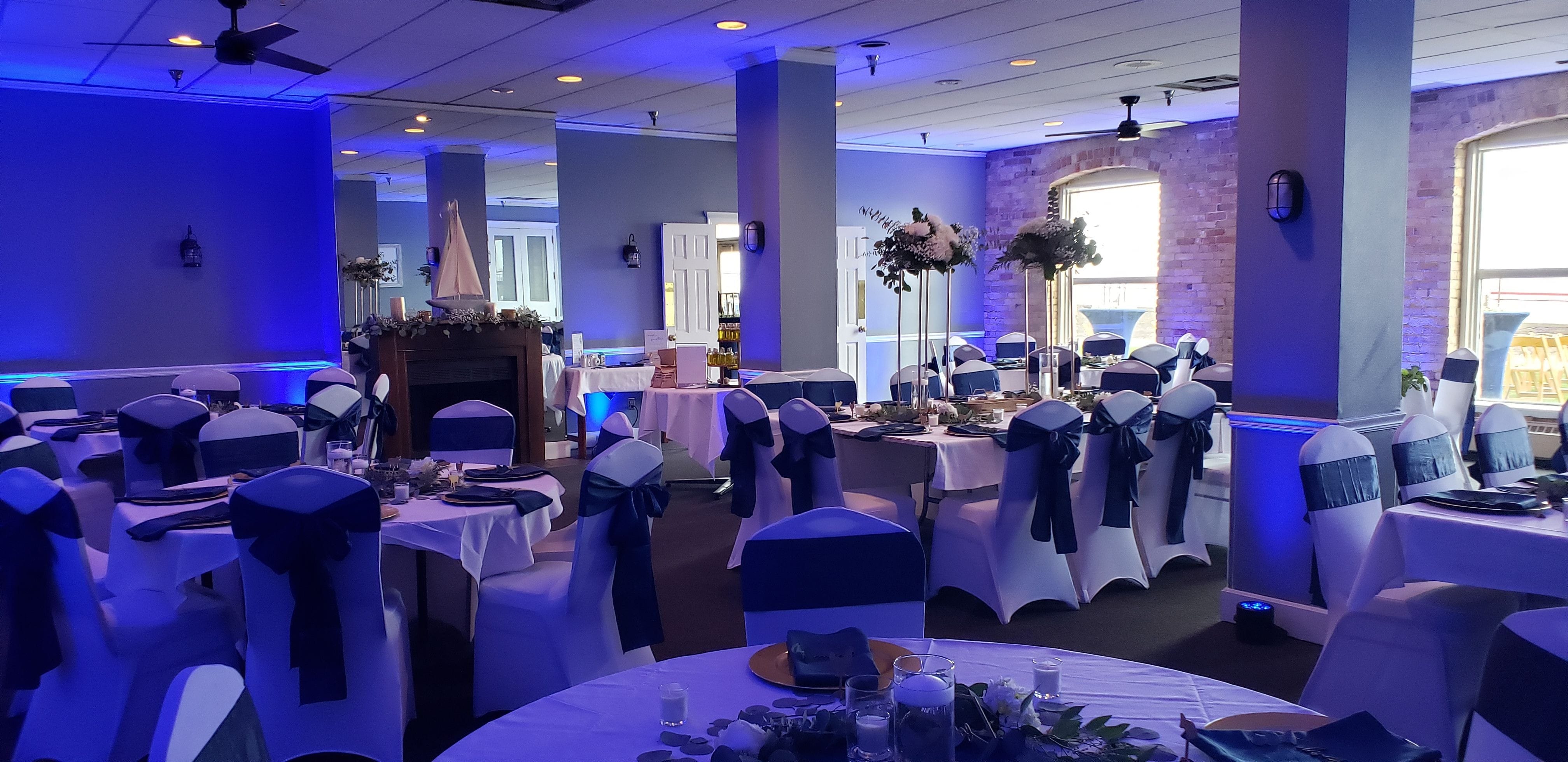 Wedding lighting at the Boat Club in Fitger's with blue up lighting by Duluth Event Lighting.