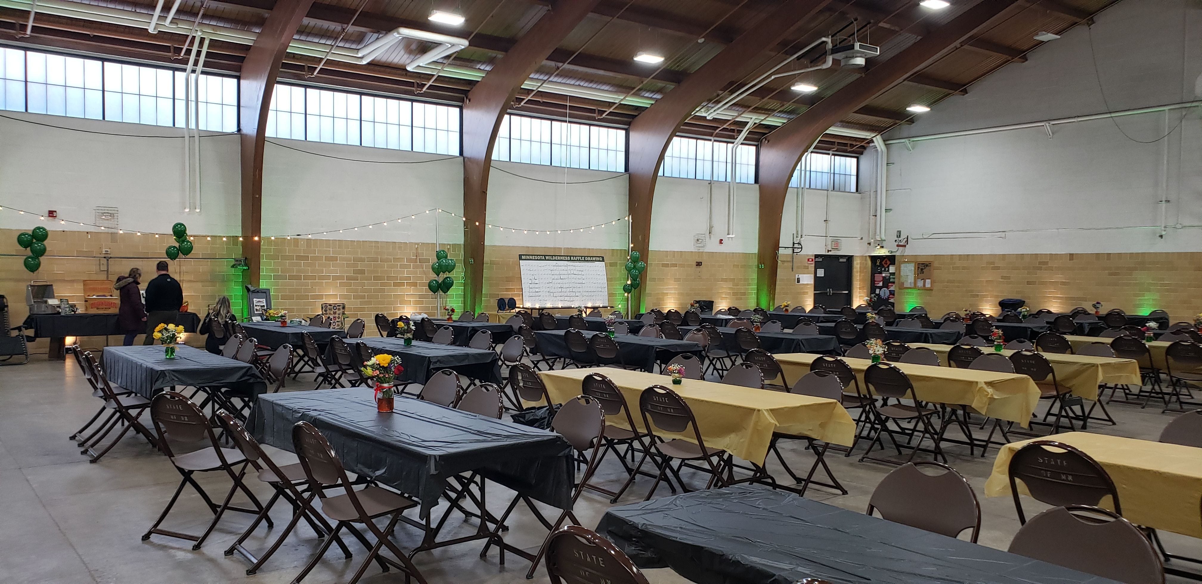 Wedding lighting at the Cloquet Armory by Duluth Event Lighting. Up lighting in green and soft white.