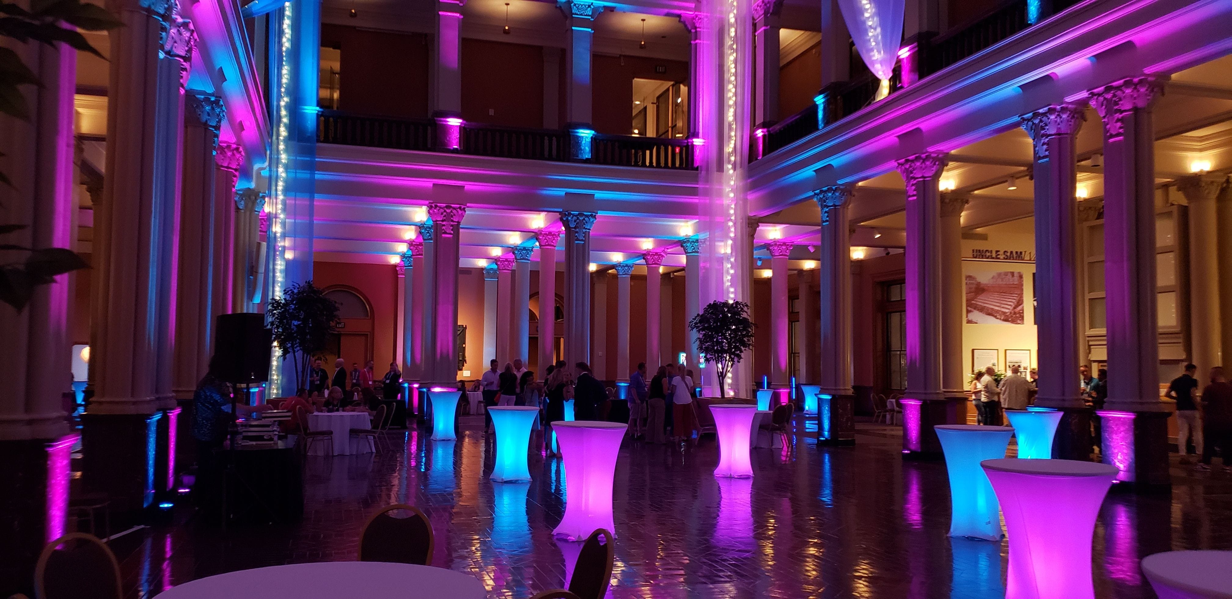 Event lighting at the Landmark Center in St. Paul with glowing cocktail tables.
