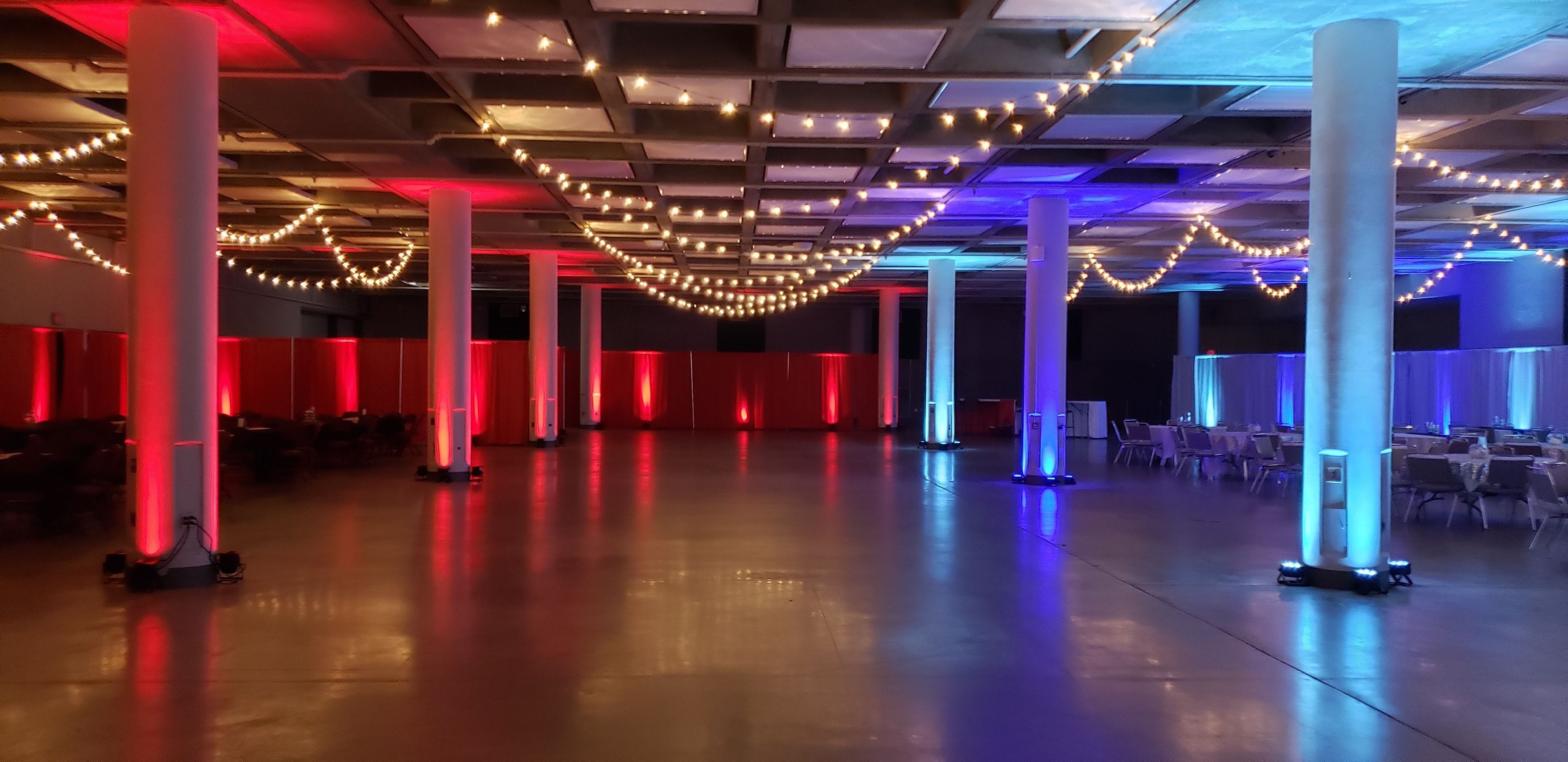 A flannel and frost themed event with red and blue up lighting, bistro, snowflake gobos and tree gobos. lighting by Duluth Event Lighting.