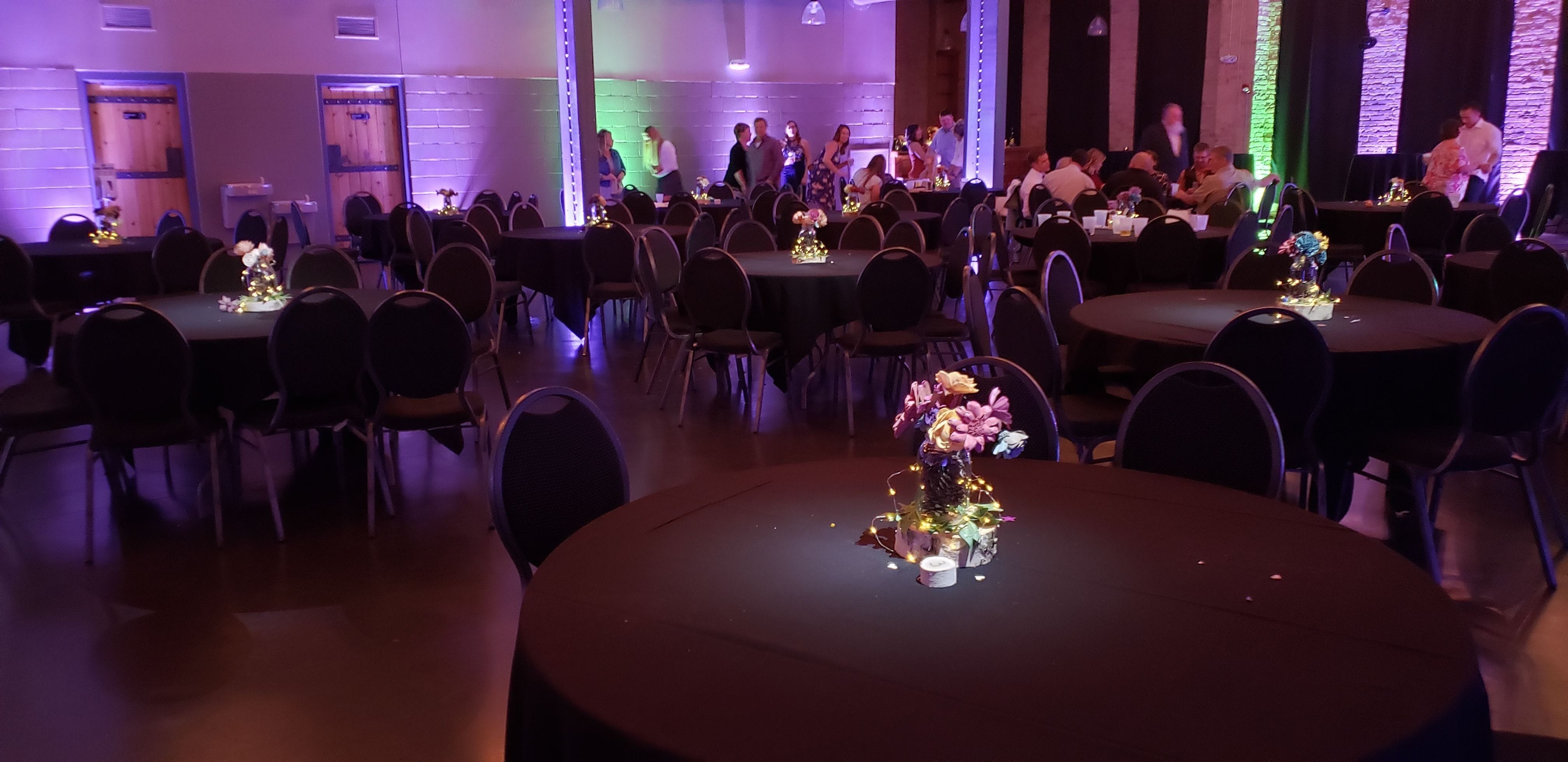 Clyde Iron Works wedding with pin spots lighting each table.