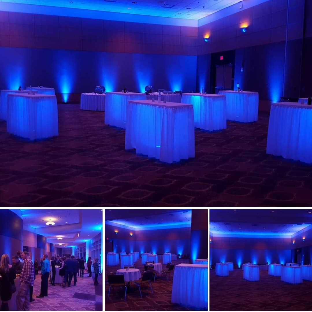 Event lighting by Duluth Event Lighting. up lighting in blue with glowing cocktail tables.